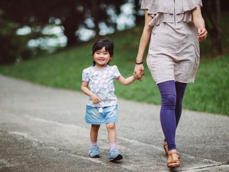 Little Girl Strolling in Park